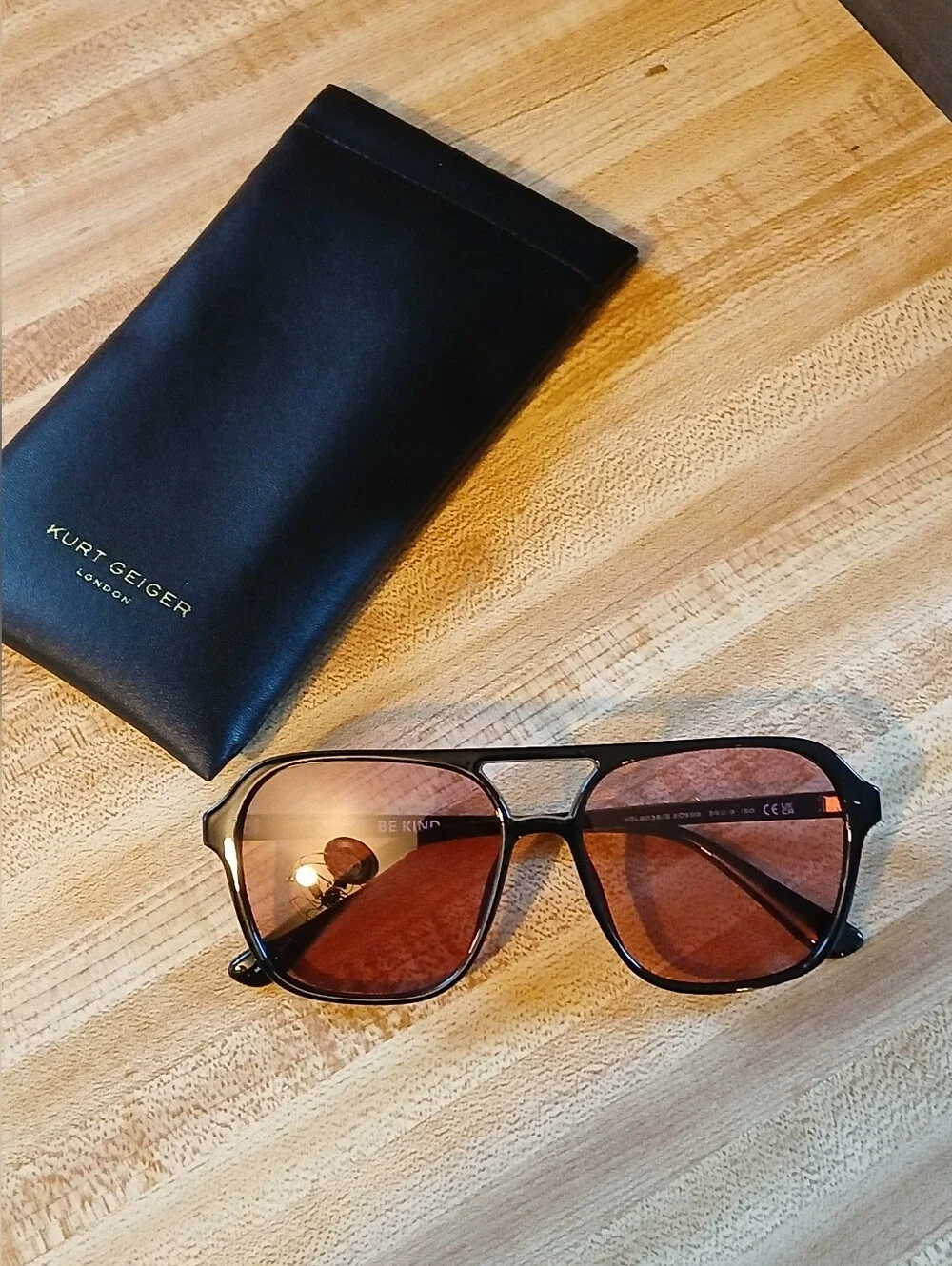 Kurt Geiger Black Frame Sunglasses with Pink Lenses